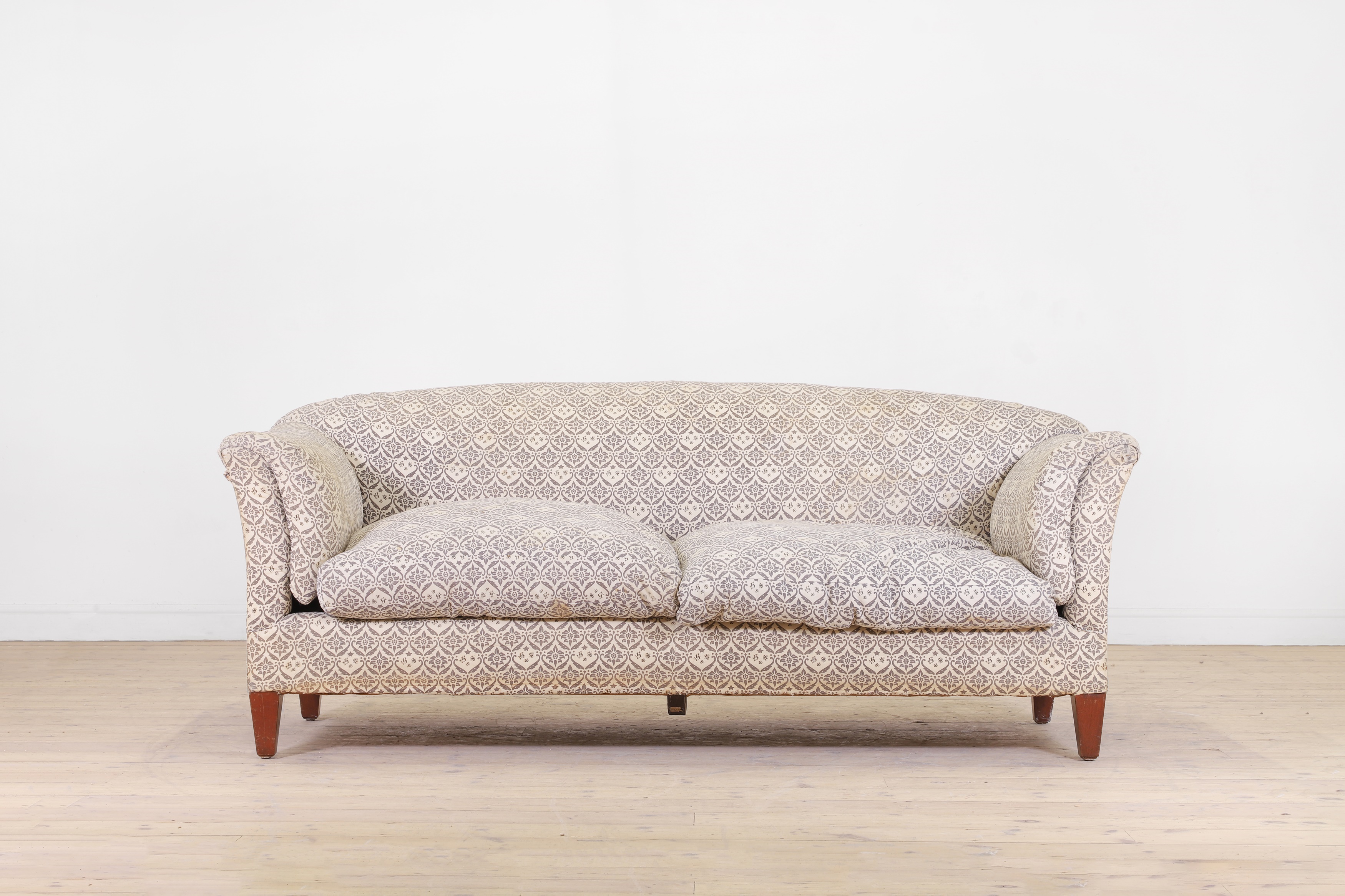 Lot 71- A two-seater sofa by Howard & Sons (£6,000-8,000)